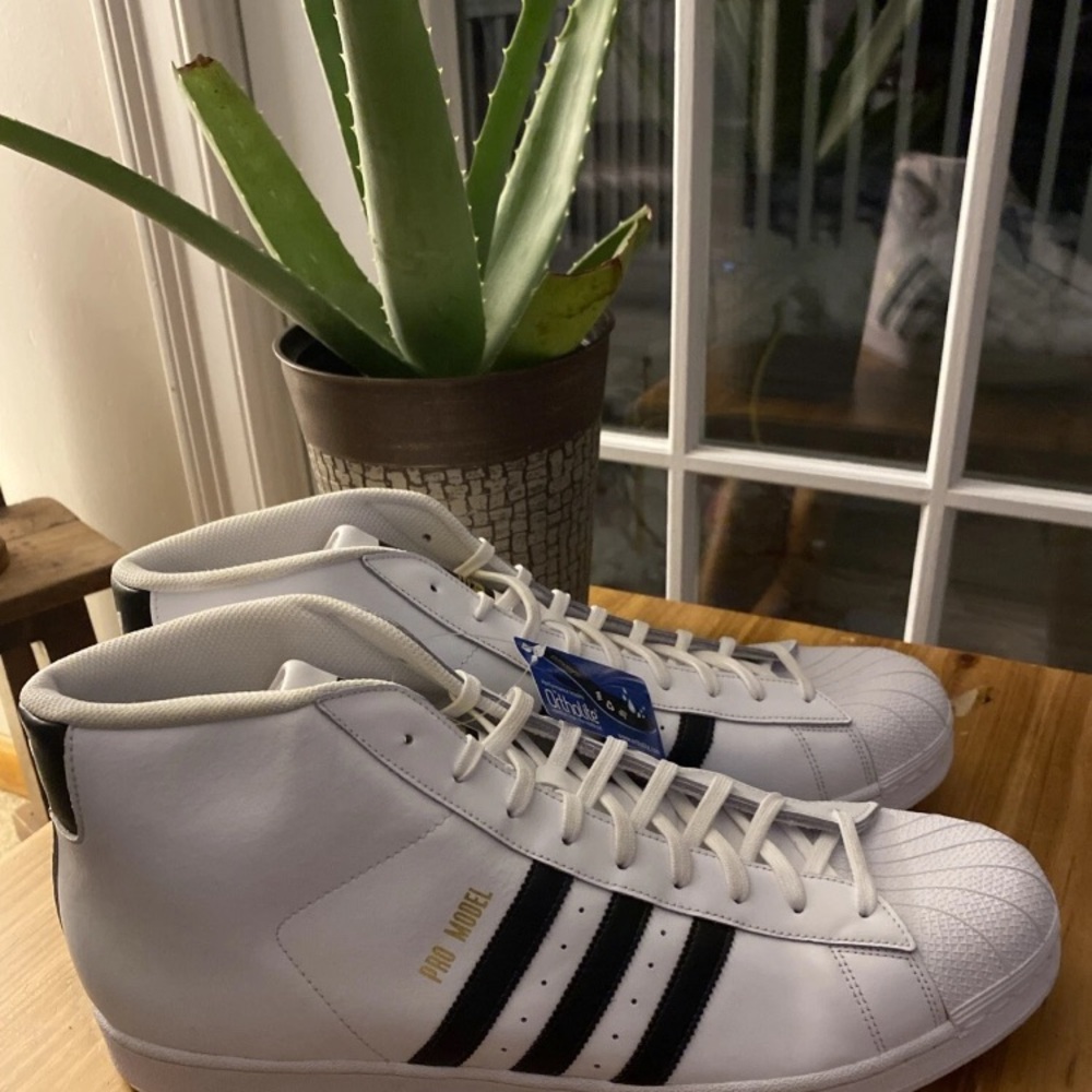 Adidas White and Black High-Top Sneakers with Gold Detail